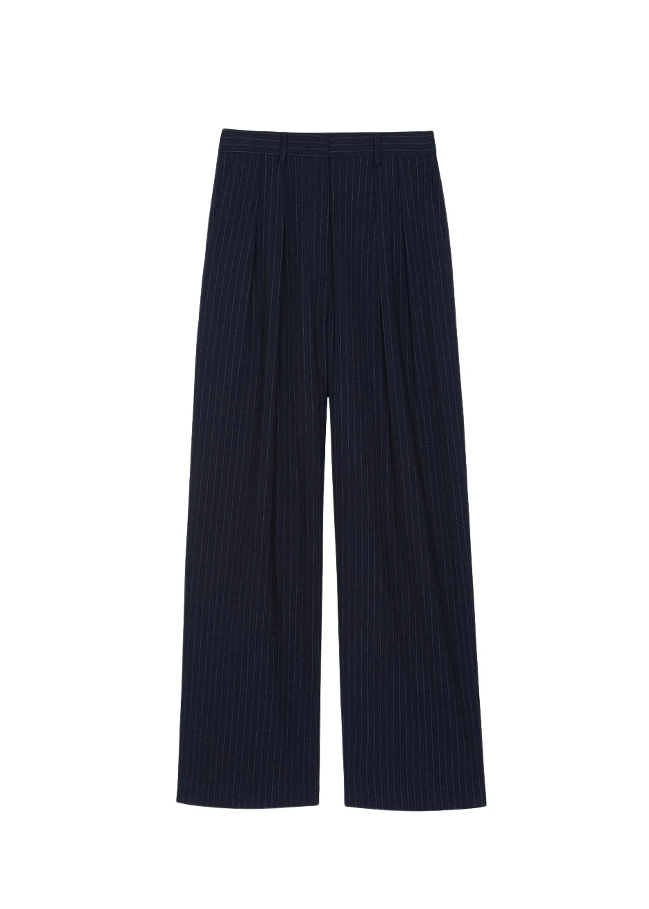The-Frankie-Shop-Tansy-Pleated-Trousers-Navy-Pinstripe-coveti79816_nobg The Frankie Shop Tansy Pleated Trousers - Navy Pinstripe - Oversized Minimalist Pants in Multicolour - Shop at Coveti