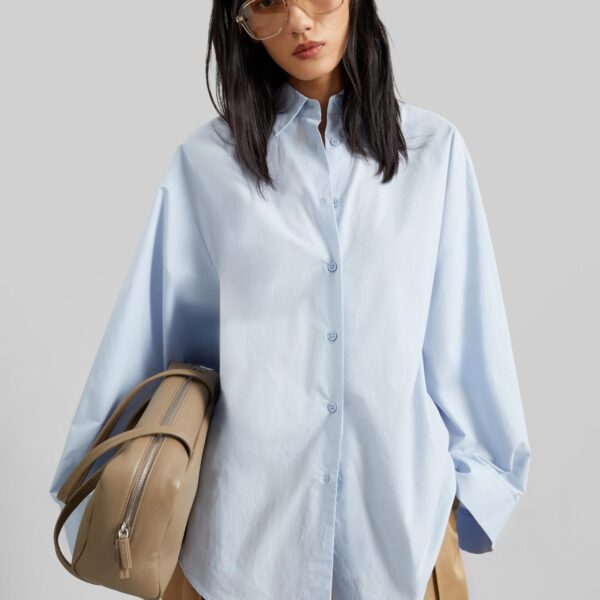 The Frankie Shop Tila Wide Sleeve Shirt - Light Blue - Oversized Minimalist Tops in Blue - Shop at Coveti