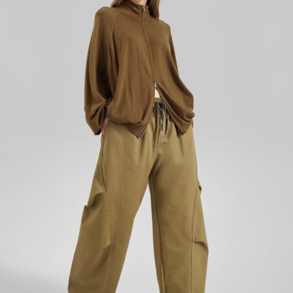 The Frankie Shop Tulsa Curved Pants - Dark Olive - Oversized Minimalist Pants in Green - Shop at Coveti