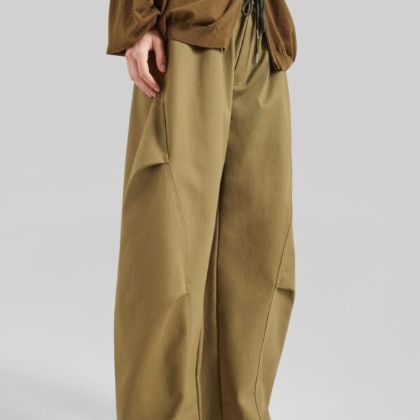 The Frankie Shop Tulsa Curved Pants - Dark Olive - Oversized Minimalist Pants in Green - Shop at Coveti