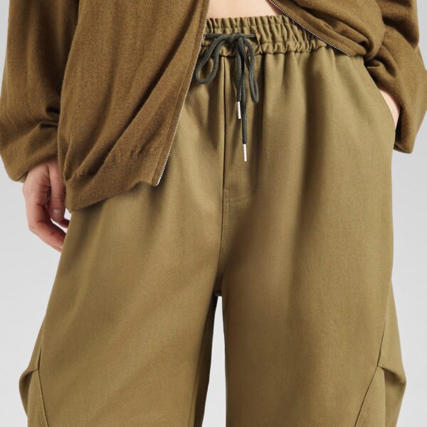 The Frankie Shop Tulsa Curved Pants - Dark Olive - Oversized Minimalist Pants in Green - Shop at Coveti