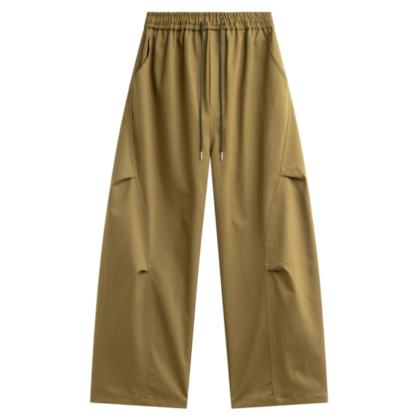 The Frankie Shop Tulsa Curved Pants - Dark Olive - Oversized Minimalist Pants in Green - Shop at Coveti