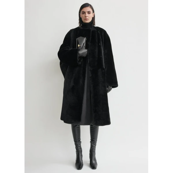 Totême Collarless Shearling Coat Black - Coats - Scandinavian Minimalist Luxury at Coveti