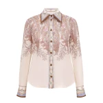 Elevate your elegance in this Zimmermann Tops available now at Coveti