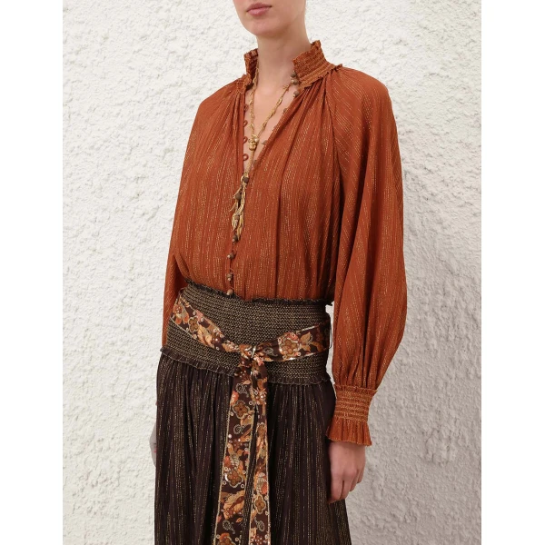 Elevate your elegance in this Zimmermann Tops available now at Coveti