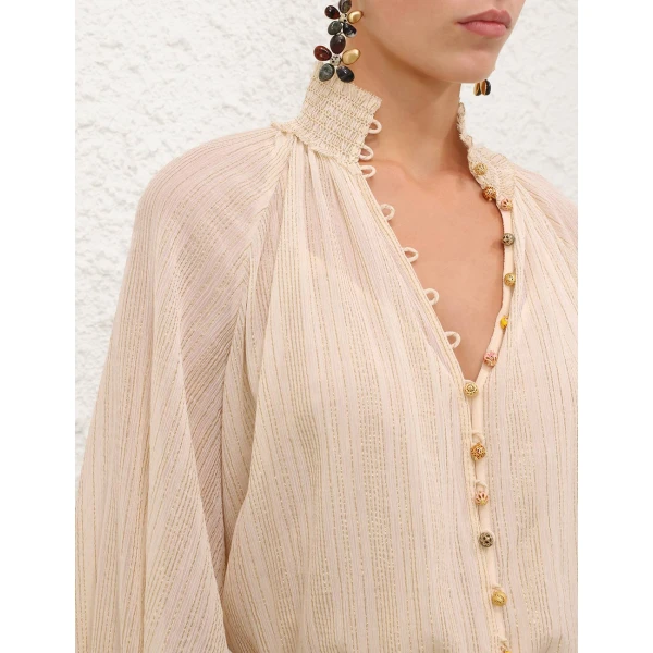 Elevate your elegance in this Zimmermann Tops available now at Coveti