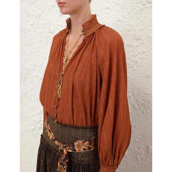 Elevate your elegance in this Zimmermann Tops available now at Coveti
