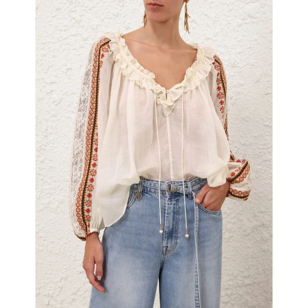 Elevate your elegance in this Zimmermann Tops available now at Coveti