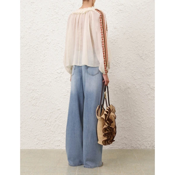 Elevate your elegance in this Zimmermann Tops available now at Coveti