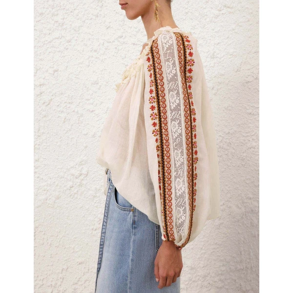 Elevate your elegance in this Zimmermann Tops available now at Coveti