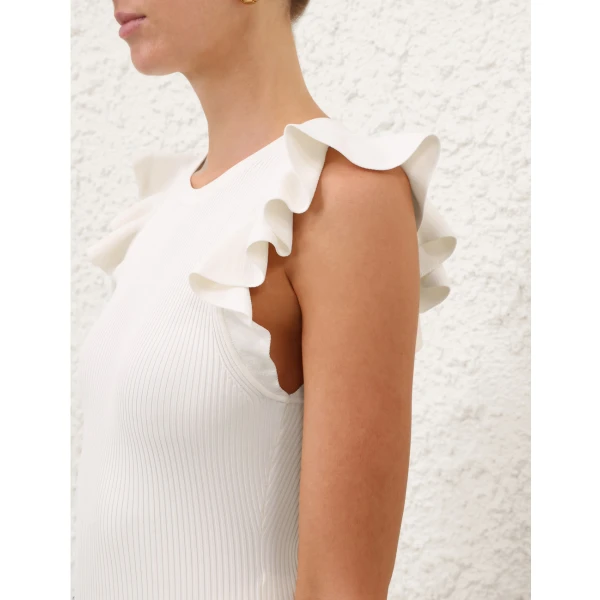 Elevate your elegance in this Zimmermann Tops available now at Coveti