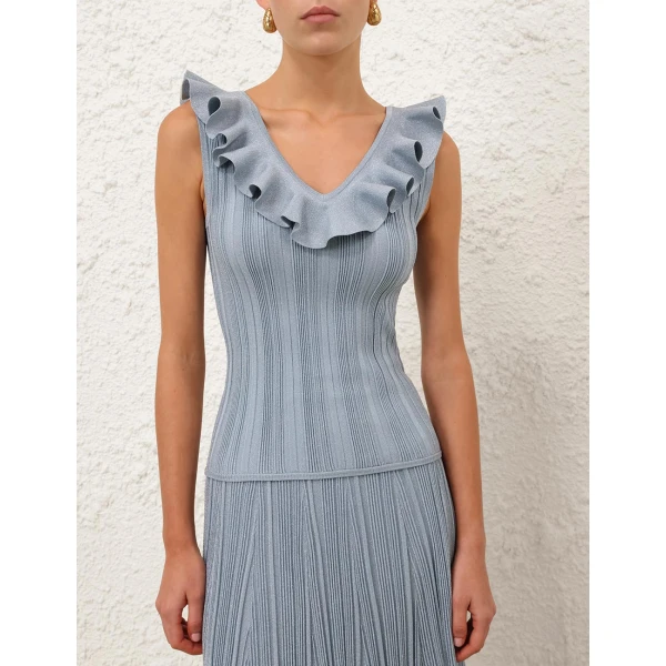 Elevate your elegance in this Zimmermann Tops available now at Coveti