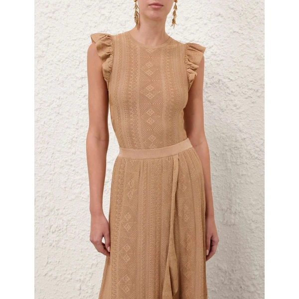 Elevate your elegance in this Zimmermann Tops available now at Coveti