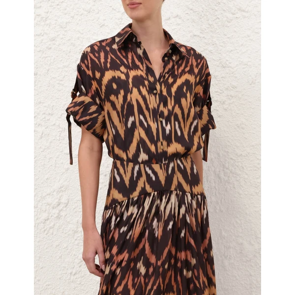 Elevate your elegance in this Zimmermann Tops available now at Coveti