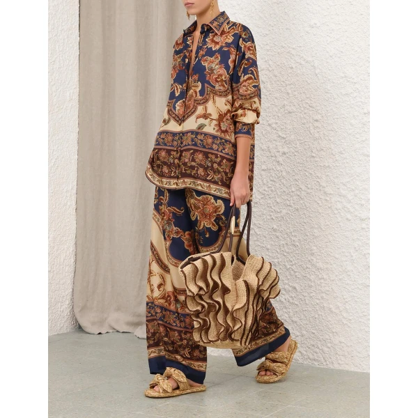Elevate your elegance in this Zimmermann Tops available now at Coveti