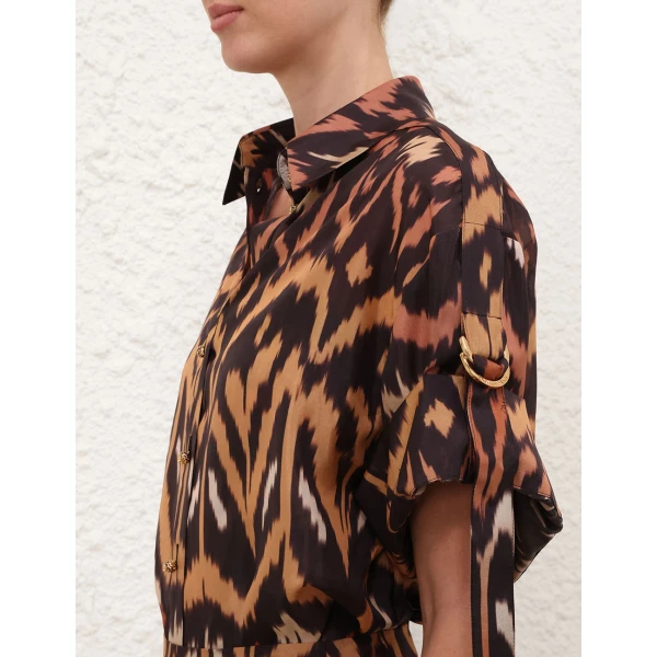 Elevate your elegance in this Zimmermann Tops available now at Coveti
