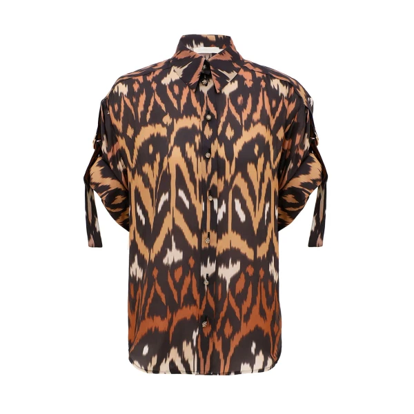 Elevate your elegance in this Zimmermann Tops available now at Coveti