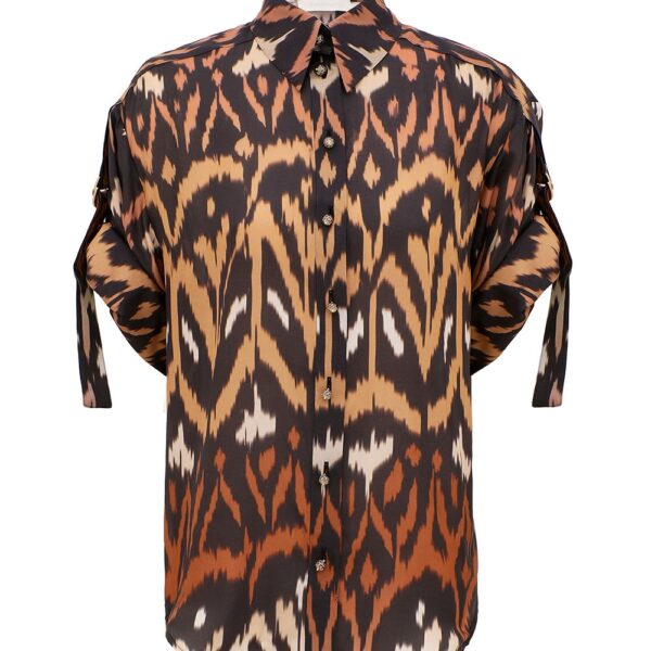 Elevate your elegance in this Zimmermann Tops available now at Coveti