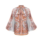 Elevate your elegance in this Zimmermann Tops available now at Coveti