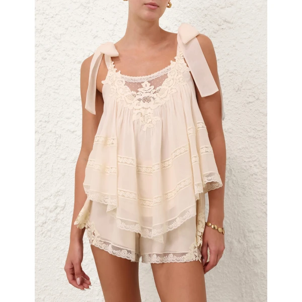 Elevate your elegance in this Zimmermann Tops available now at Coveti