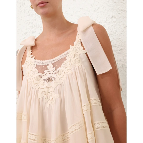 Elevate your elegance in this Zimmermann Tops available now at Coveti