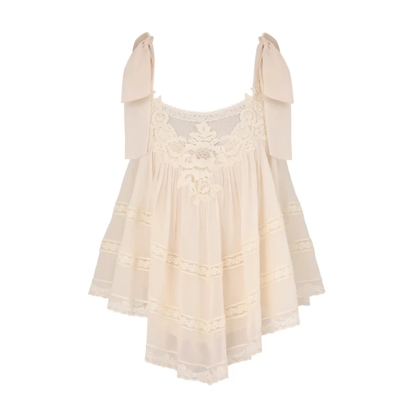 Elevate your elegance in this Zimmermann Tops available now at Coveti