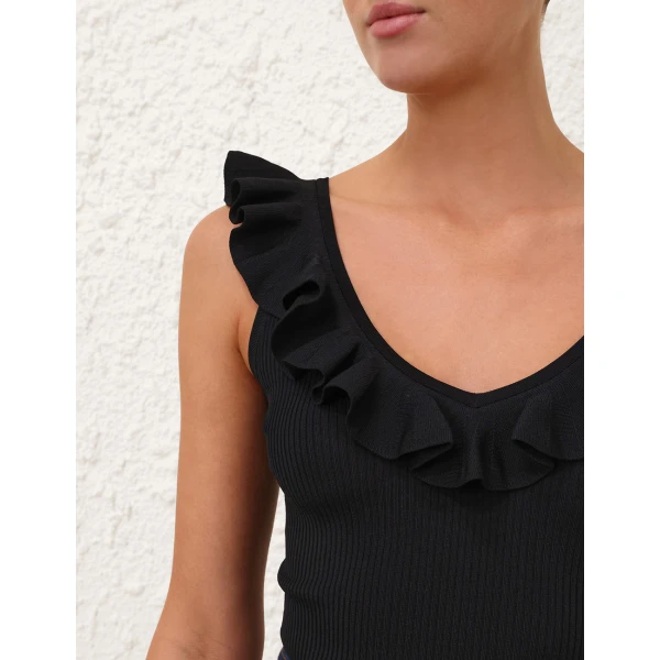 Elevate your elegance in this Zimmermann Tops available now at Coveti