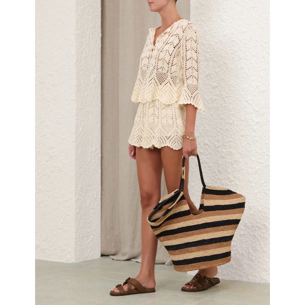 Elevate your elegance in this Zimmermann Tops available now at Coveti