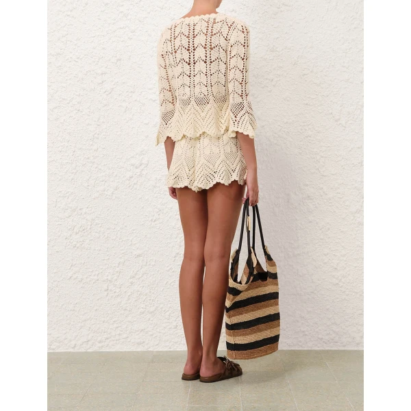Elevate your elegance in this Zimmermann Tops available now at Coveti