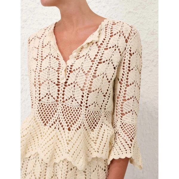 Elevate your elegance in this Zimmermann Tops available now at Coveti