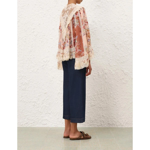 Elevate your elegance in this Zimmermann Tops available now at Coveti