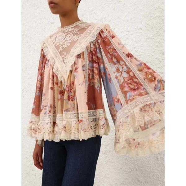 Elevate your elegance in this Zimmermann Tops available now at Coveti