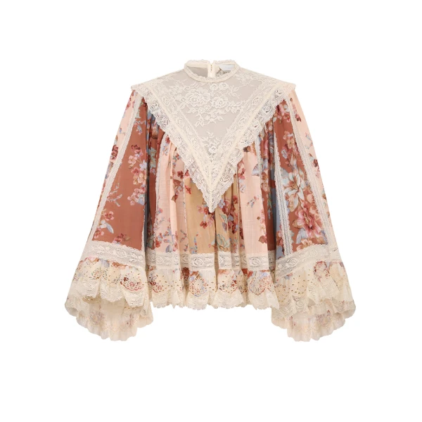 Elevate your elegance in this Zimmermann Tops available now at Coveti
