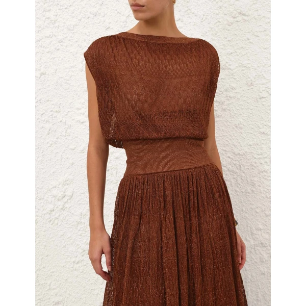 Elevate your elegance in this Zimmermann Tops available now at Coveti