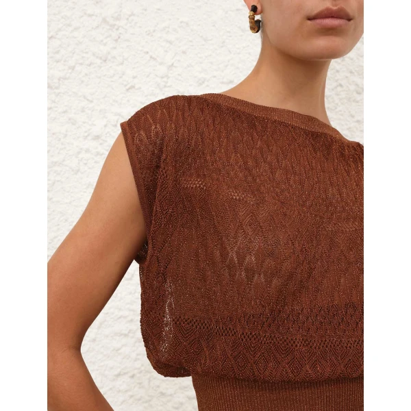 Elevate your elegance in this Zimmermann Tops available now at Coveti