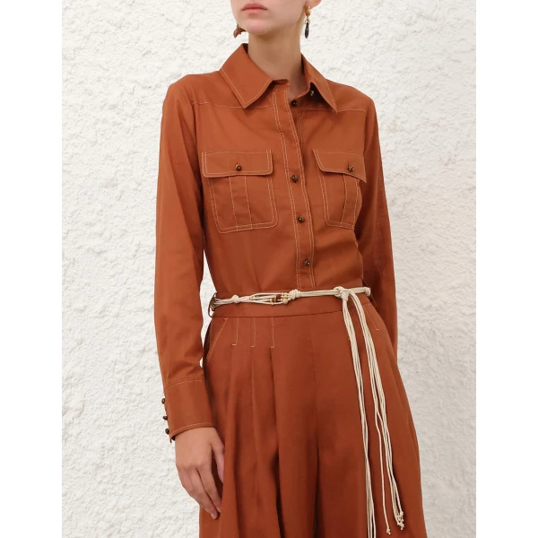 Elevate your elegance in this Zimmermann Tops available now at Coveti