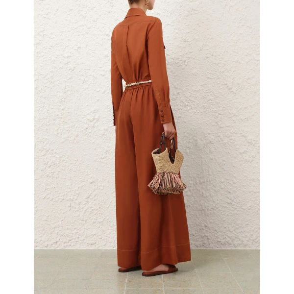 Elevate your elegance in this Zimmermann Tops available now at Coveti