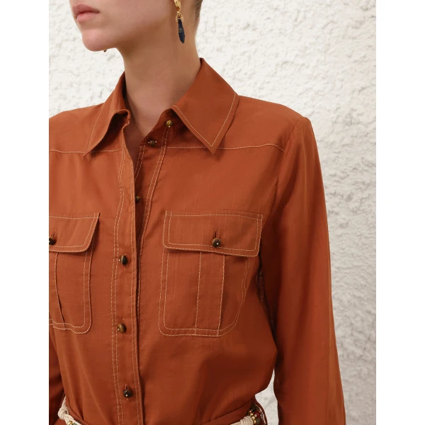 Elevate your elegance in this Zimmermann Tops available now at Coveti