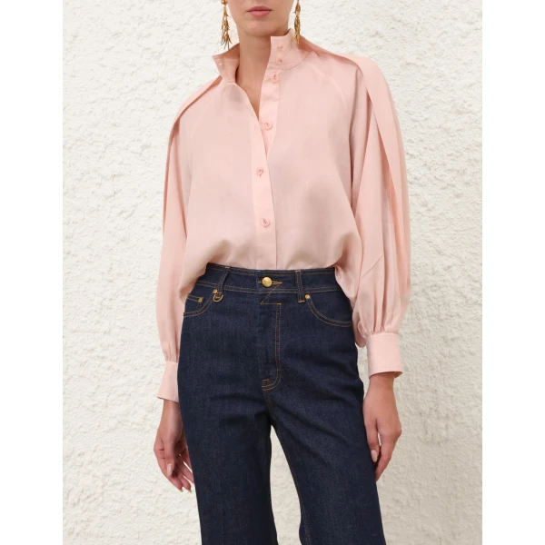 Elevate your elegance in this Zimmermann Tops available now at Coveti
