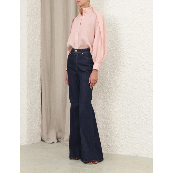 Elevate your elegance in this Zimmermann Tops available now at Coveti
