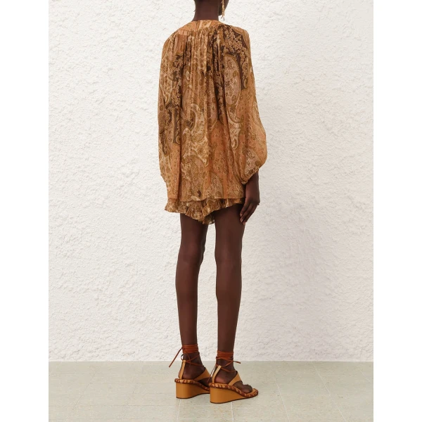 Elevate your elegance in this Zimmermann Tops available now at Coveti