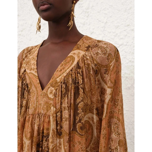 Elevate your elegance in this Zimmermann Tops available now at Coveti