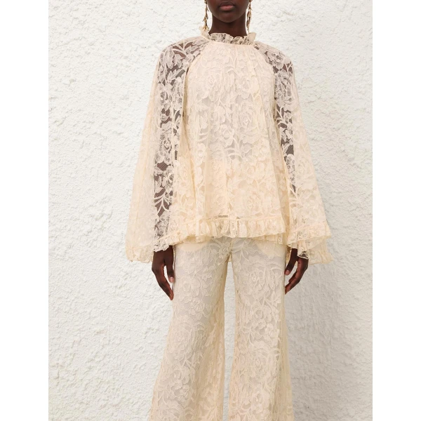 Elevate your elegance in this Zimmermann Tops available now at Coveti