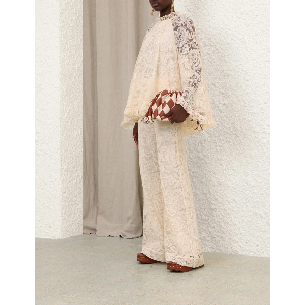 Elevate your elegance in this Zimmermann Tops available now at Coveti
