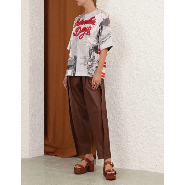 Elevate your elegance in this Zimmermann Tops available now at Coveti
