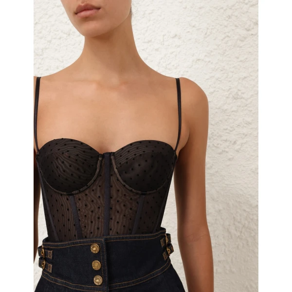 Elevate your elegance in this Zimmermann Tops available now at Coveti