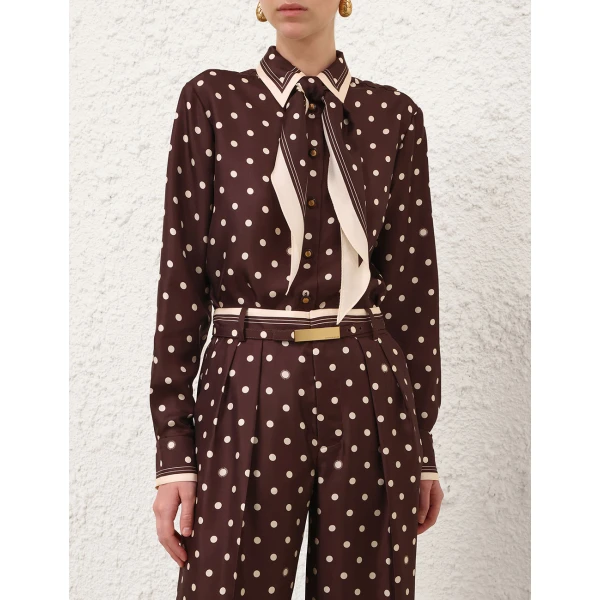 Elevate your elegance in this Zimmermann Tops available now at Coveti
