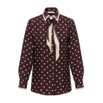 Elevate your elegance in this Zimmermann Tops available now at Coveti