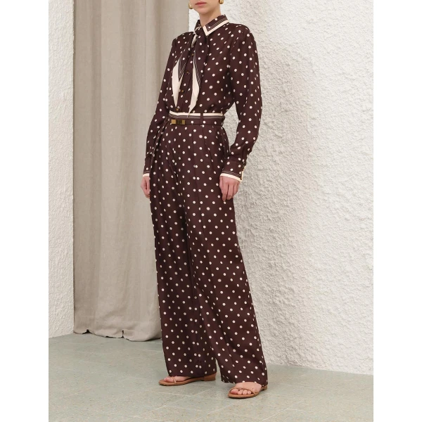 Elevate your elegance in this Zimmermann Tops available now at Coveti