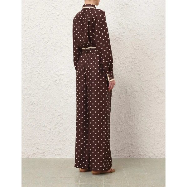 Elevate your elegance in this Zimmermann Tops available now at Coveti